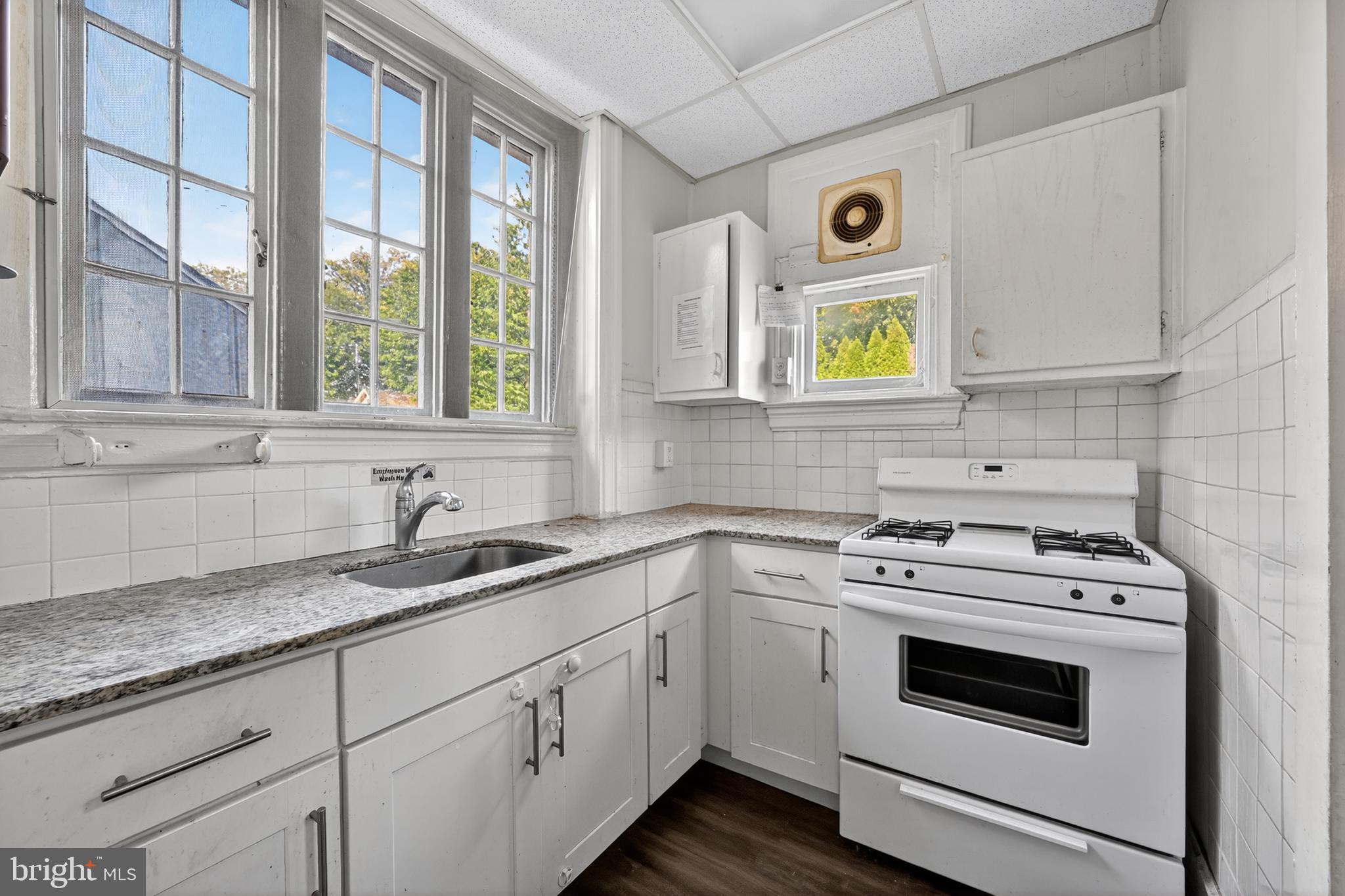 223 East Park Road Havertown, PA 19083 - Photo 29 of 43 a kitchen with a sink stove and cabinets