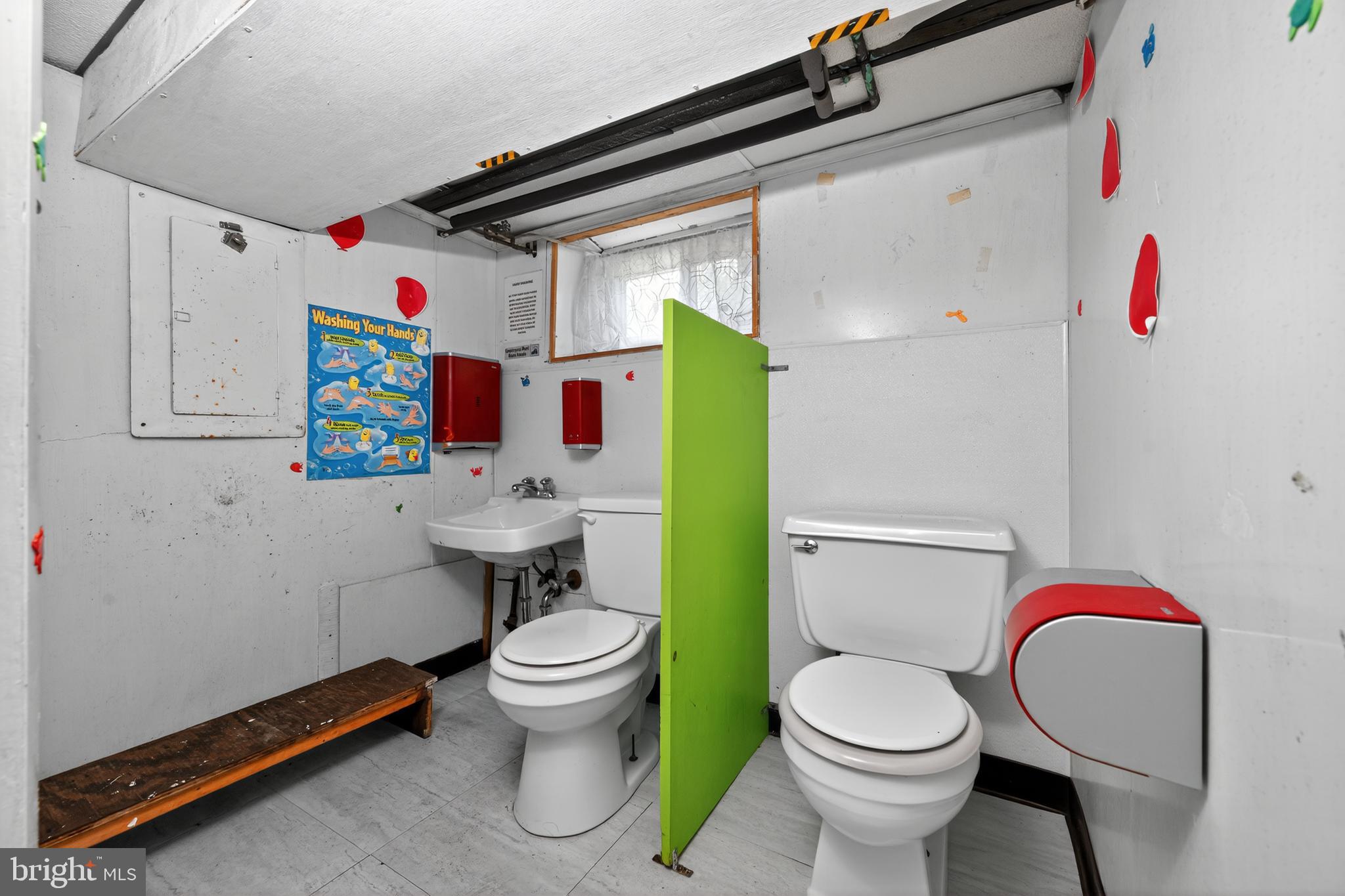 223 East Park Road Havertown, PA 19083 - Photo 32 of 43 a white toilet sitting next to a bathroom sink and vanity