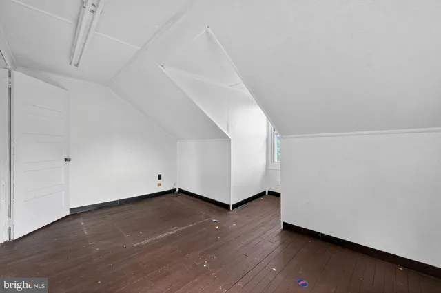 a view of an empty room with a windows