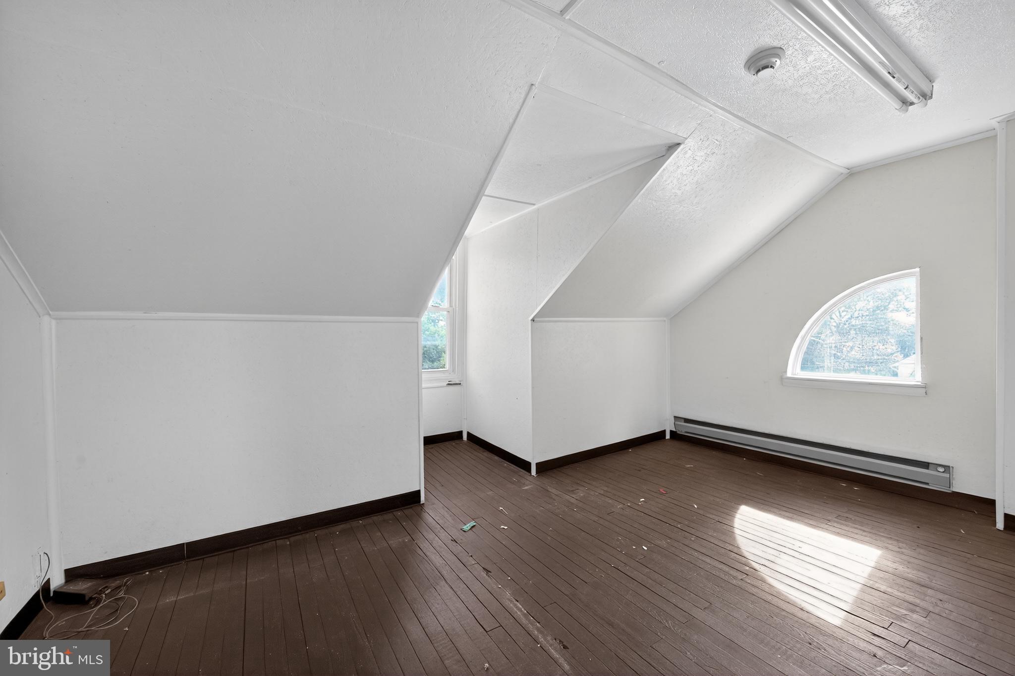 223 East Park Road Havertown, PA 19083 - Photo 38 of 43 a view of an empty room with wooden floor and a window