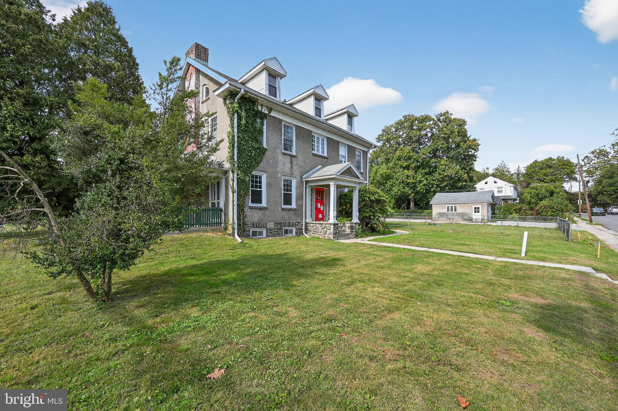 223 East Park Road Havertown, PA 19083 - Photo 6 of 43 a view of a house with a backyard and a patio