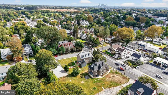 an aerial view of a house with a swimming pool