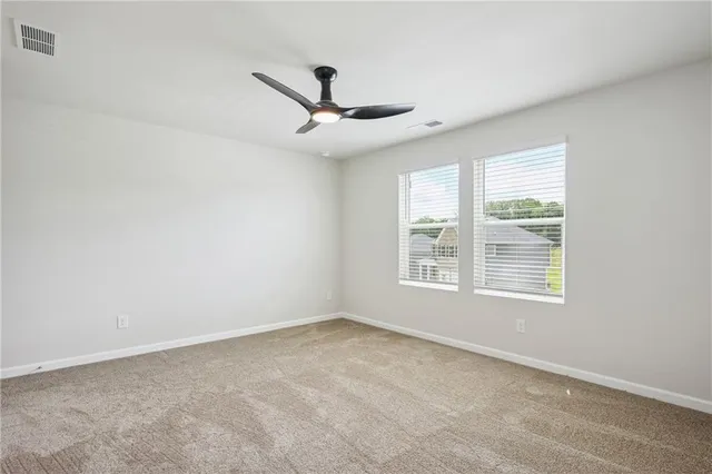 a bathroom with a granite countertop bathtub sink double and mirror