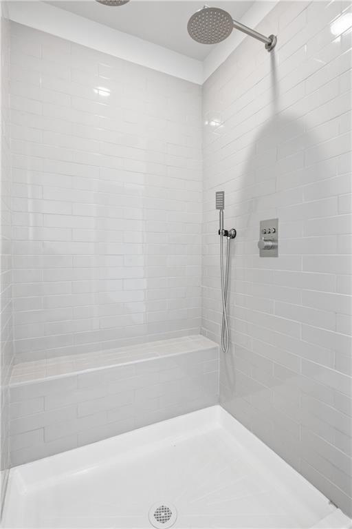 685 Egrets Landing, Unit 58 Covington, GA 30014 - Photo 22 of 41 a bathroom with a shower and a bath tub