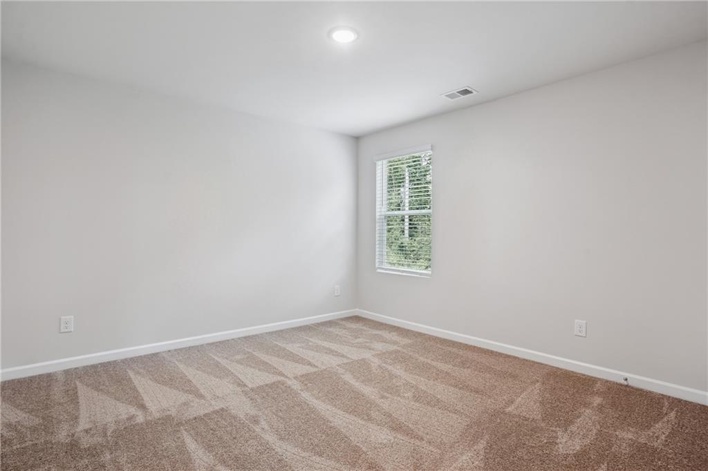685 Egrets Landing, Unit 58 Covington, GA 30014 - Photo 29 of 41 an empty room with a window