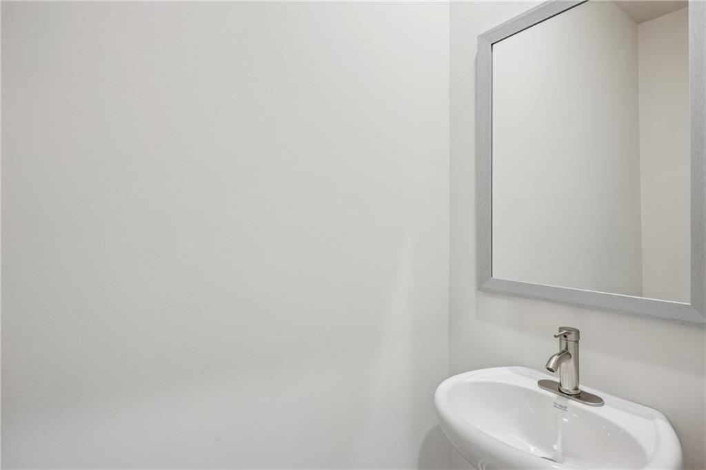 685 Egrets Landing, Unit 58 Covington, GA 30014 - Photo 35 of 41 a bathroom with a sink and a mirror