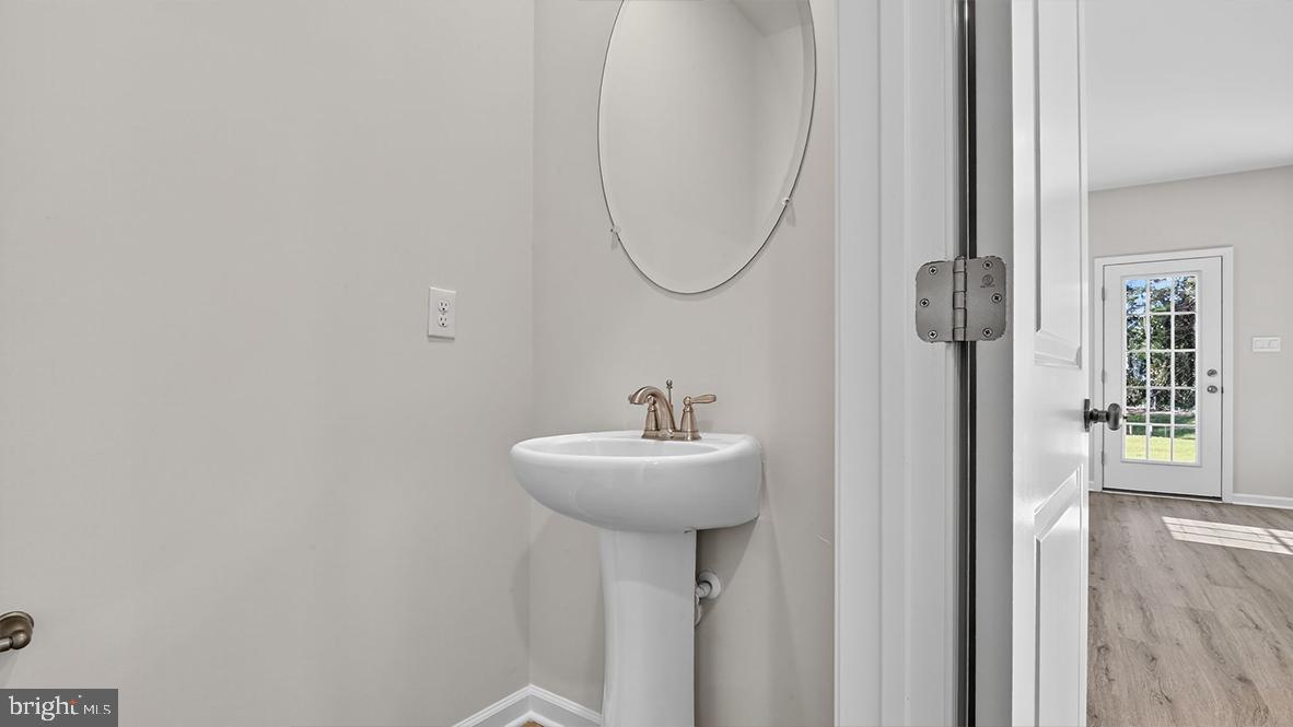 204 Bentz Avenue Villas, NJ 08251 - Photo 11 of 22 a bathroom with a sink a mirror and a window