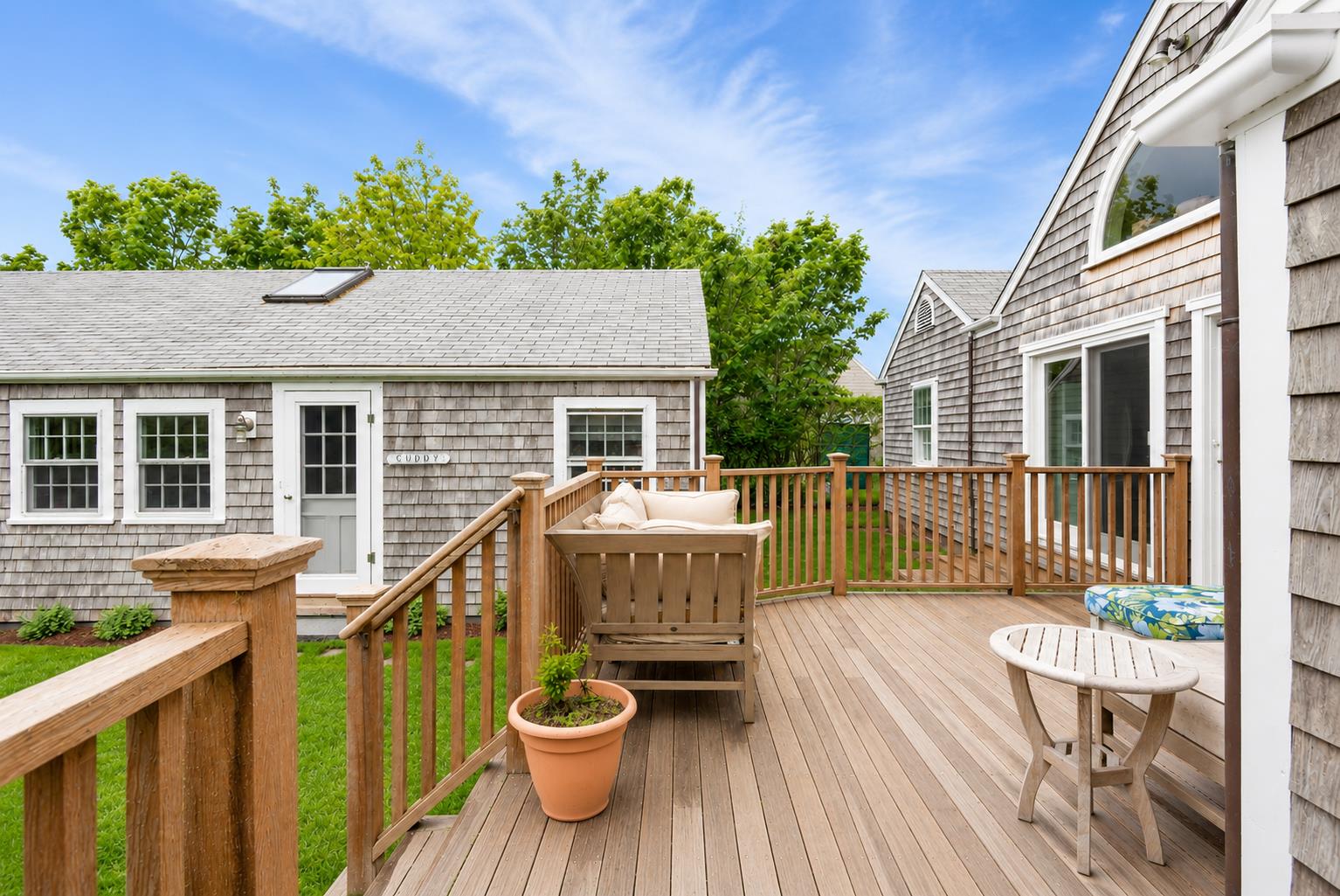 12 King Street Nantucket, MA 02554 - Photo 30 of 32 a balcony with wooden floor table and chairs