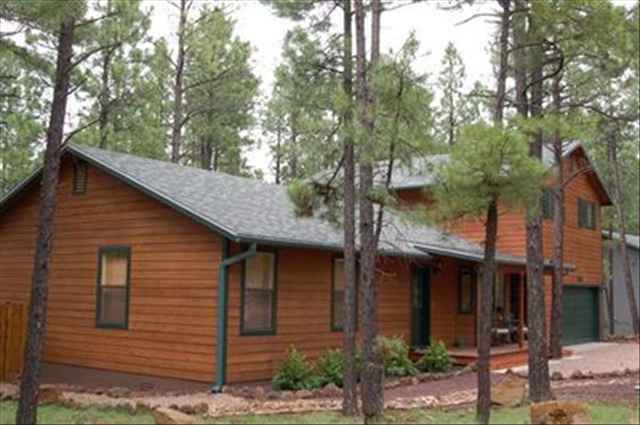 7168 Moon Pinetop, AZ 85935 - Photo 1 of 5 a view of a house with a tree