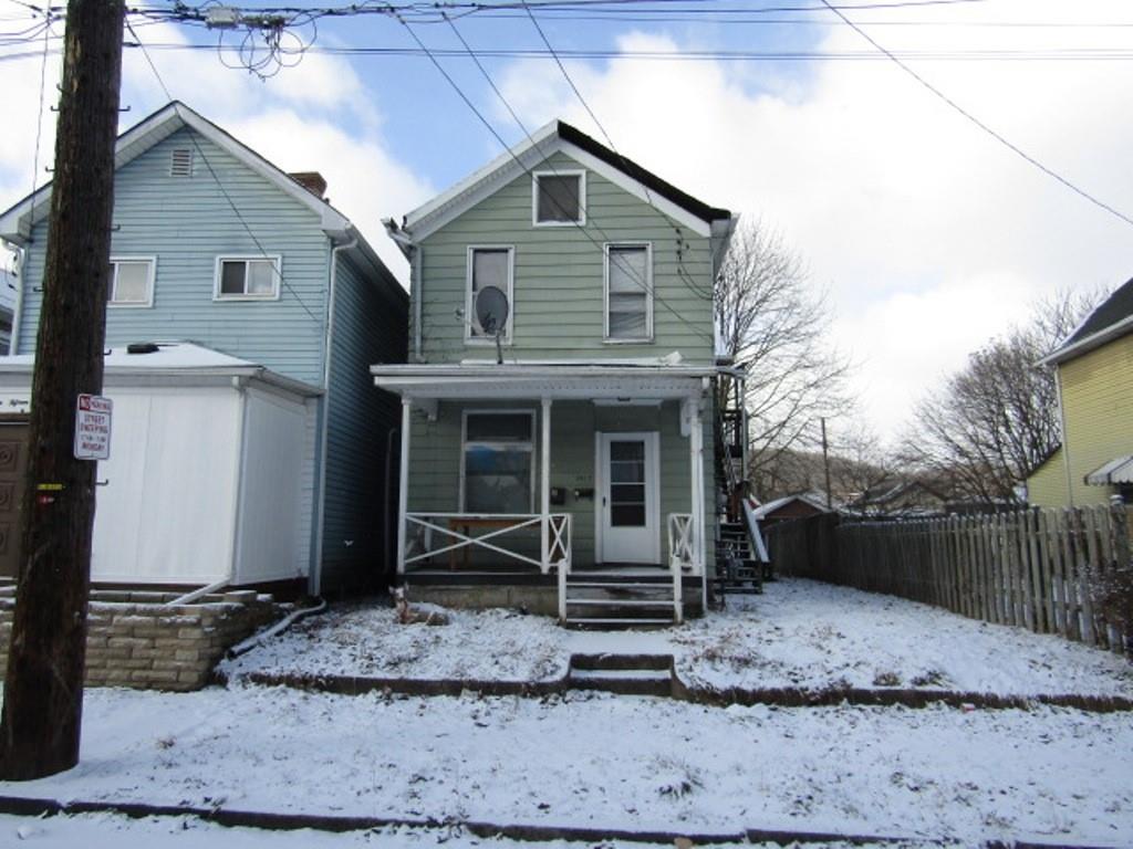 1817 4th Avenue Beaver Falls, PA 15010 - Photo 1 of 33 a front view of a house with garden