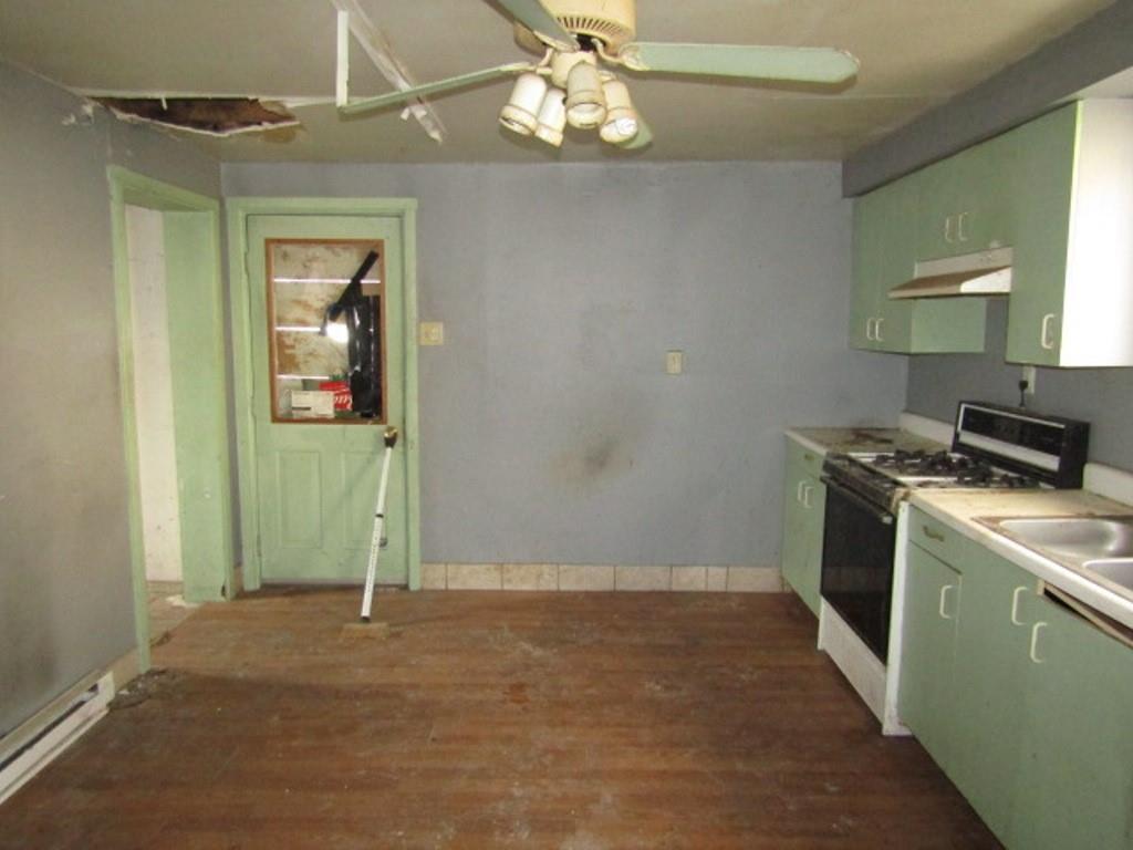 1817 4th Avenue Beaver Falls, PA 15010 - Photo 13 of 33 a view of a kitchen with a sink cabinet and a window