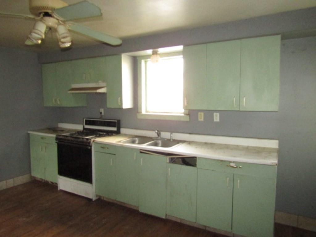 1817 4th Avenue Beaver Falls, PA 15010 - Photo 14 of 33 a kitchen with a sink and a stove top oven