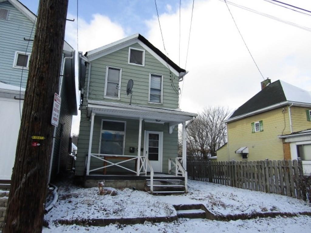 1817 4th Avenue Beaver Falls, PA 15010 - Photo 2 of 33 a front view of a house with garden