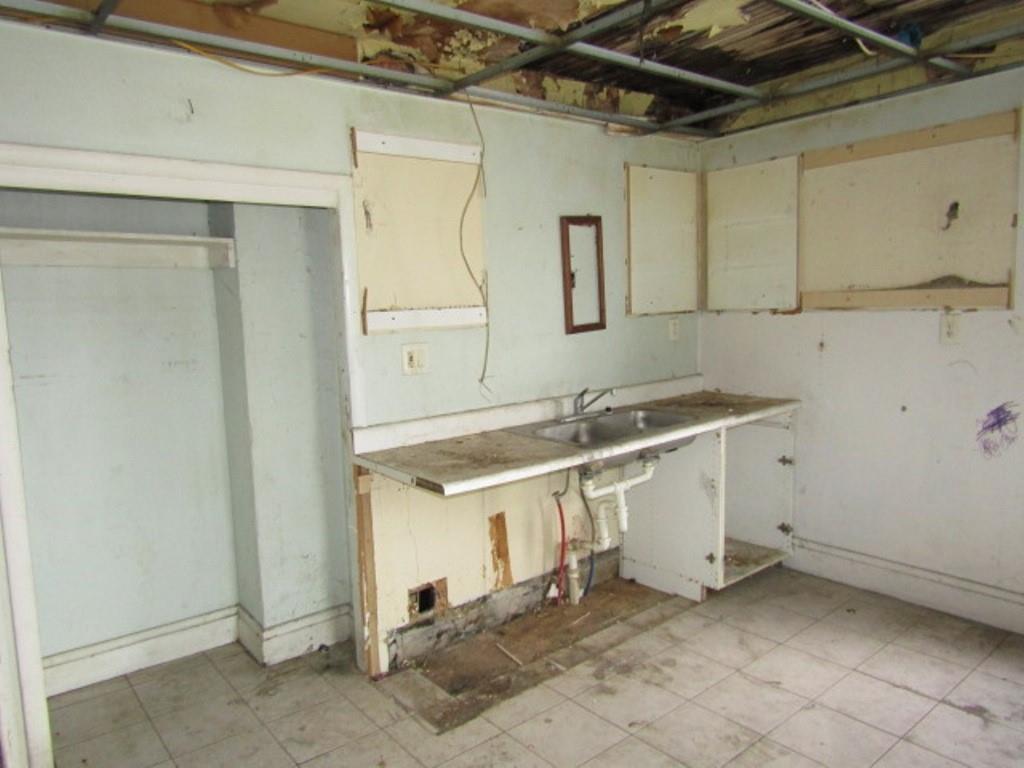 1817 4th Avenue Beaver Falls, PA 15010 - Photo 29 of 33 a bathroom with a sink and a mirror
