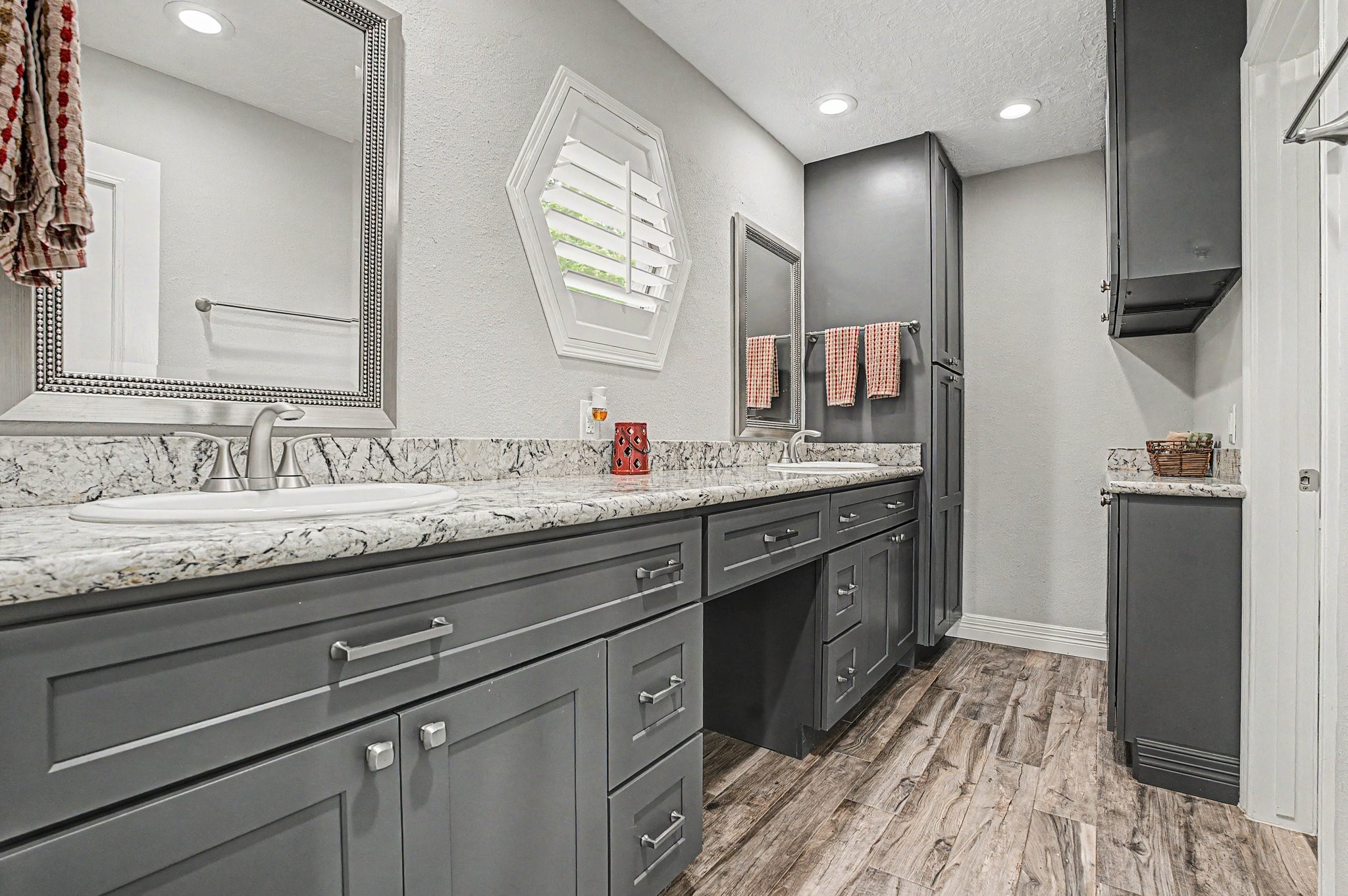 35564 Brumlow Road Hempstead, TX 77445 - Photo 16 of 46 a spacious bathroom with a granite countertop sink a toilet and a mirror