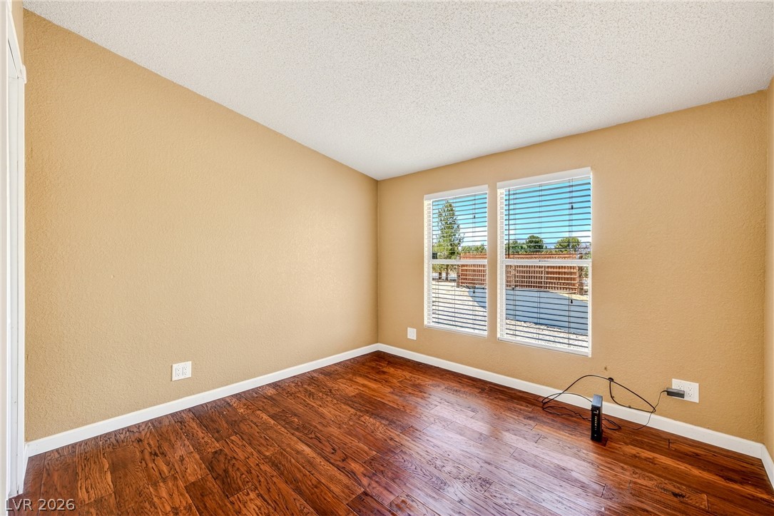 1831 West Horn Road Pahrump, NV 89048 - Photo 18 of 59 Naturally illuminated interiors and rich hardwood flooring define this versatile space, awaiting your personal touch.