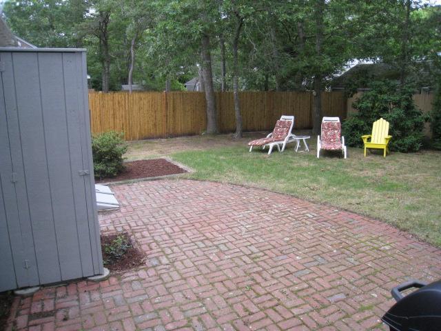 20 Farm Hill Road Centerville, MA 02632 - Photo 25 of 33 a view of a backyard with small cabin