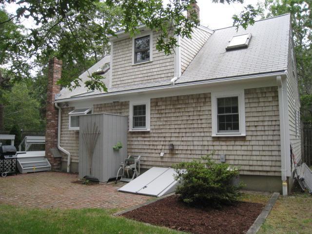 20 Farm Hill Road Centerville, MA 02632 - Photo 27 of 33 a view of a house with a yard and sitting area