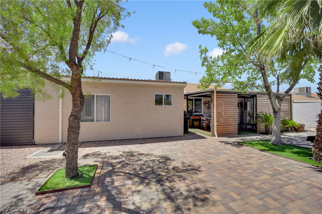 530 Grape Drive Henderson, NV 89015 - Photo 33 of 39 A private backyard oasis features an inviting outdoor living area with a patio, perfect for alfresco dining.