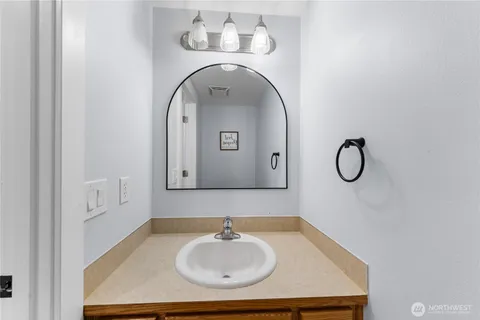 a bathroom with a sink and mirror