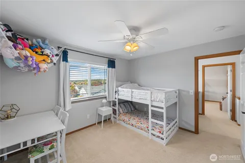 a bedroom with furniture and a window