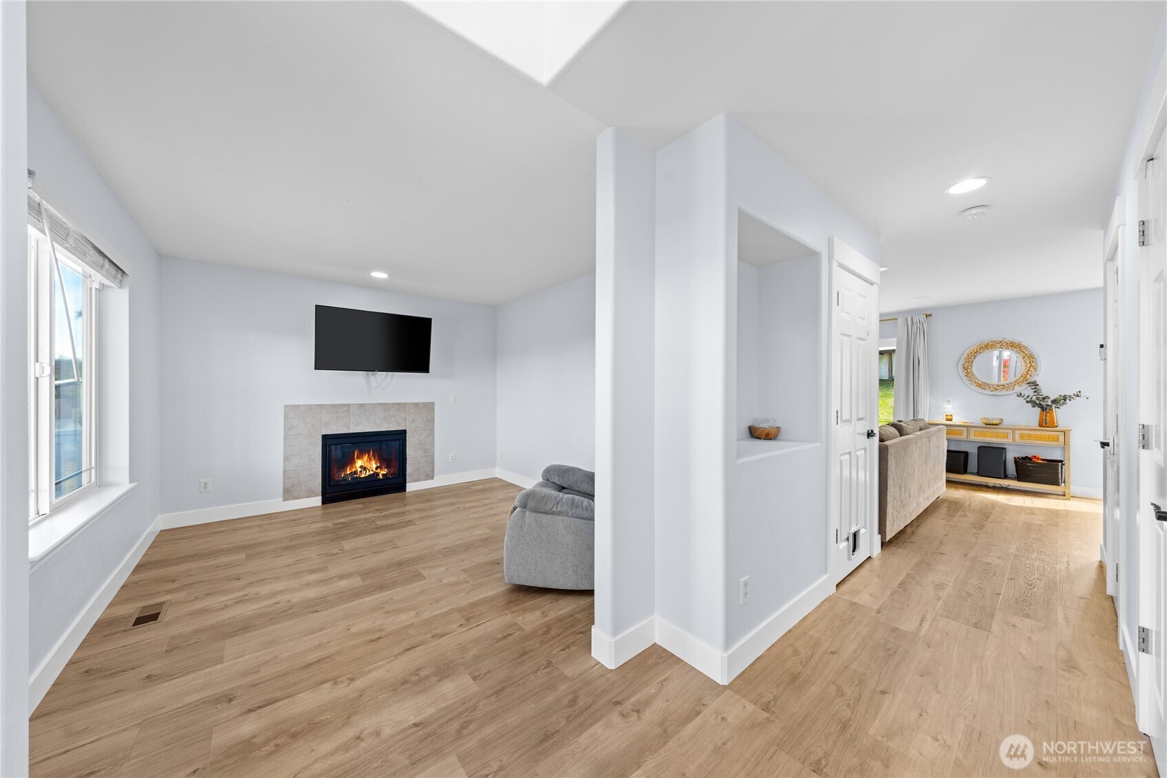 1608 Southwest Union Street Oak Harbor, WA 98277 - Photo 3 of 40 a view of a livingroom with a fireplace cabinet and window