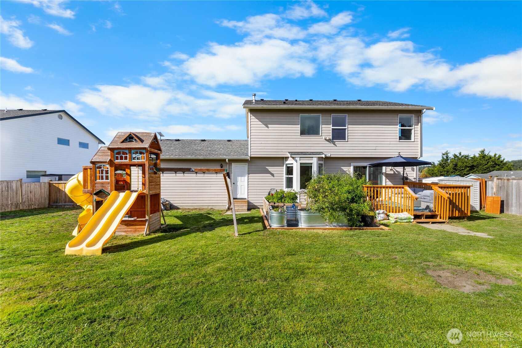 1608 Southwest Union Street Oak Harbor, WA 98277 - Photo 34 of 40 a view of a house with a big yard and a fountain