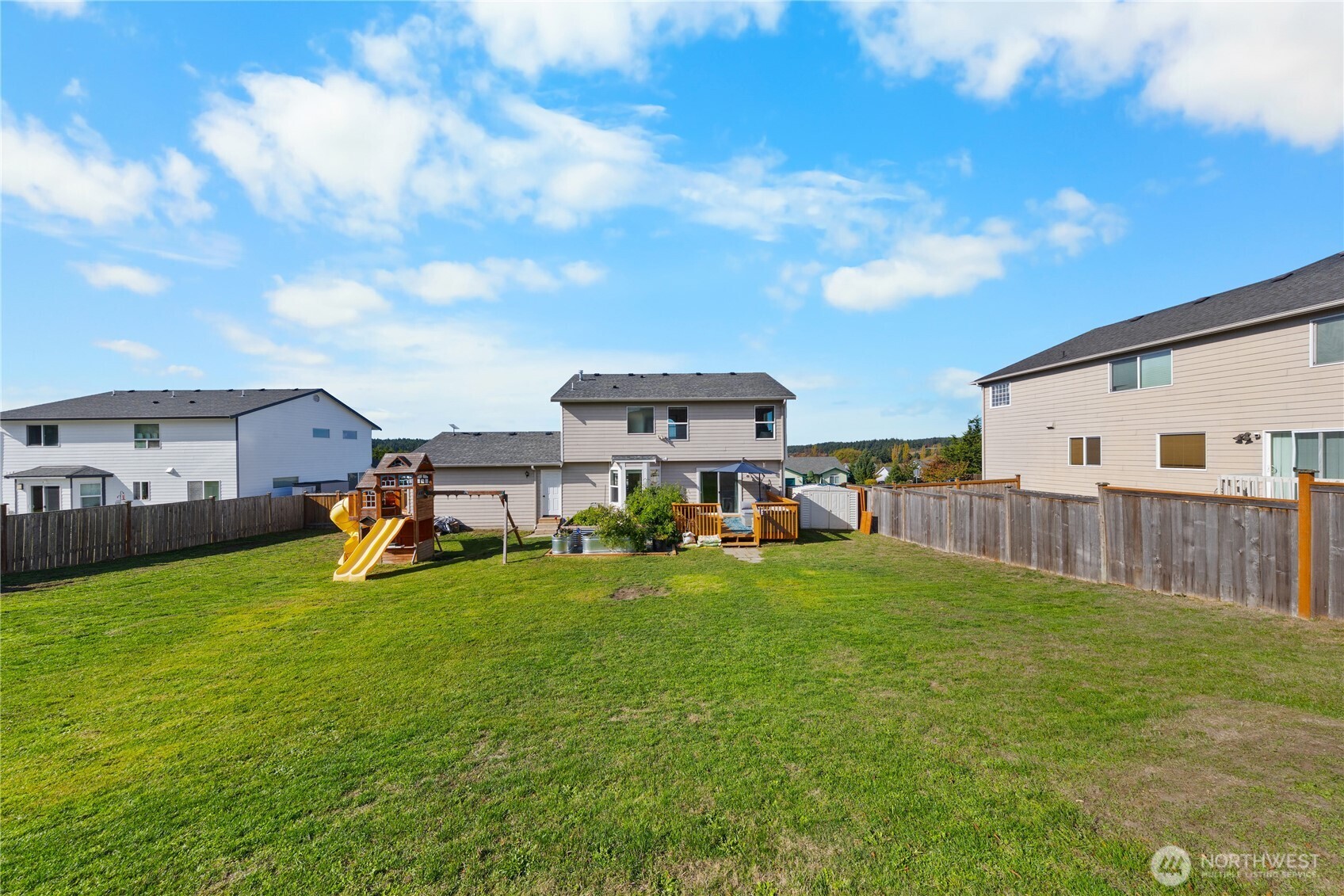 1608 Southwest Union Street Oak Harbor, WA 98277 - Photo 35 of 40 a view of a house with backyard and porch