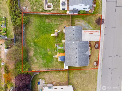 an aerial view of a house with a lake view