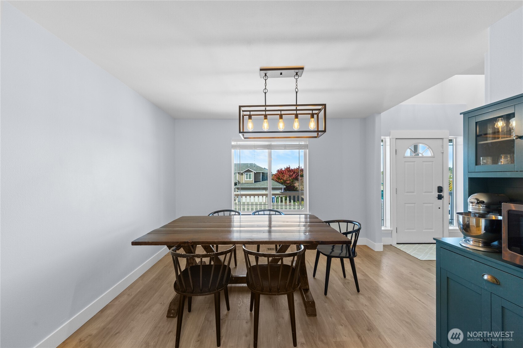 1608 Southwest Union Street Oak Harbor, WA 98277 - Photo 5 of 40 a view of a dining room with furniture and wooden floor