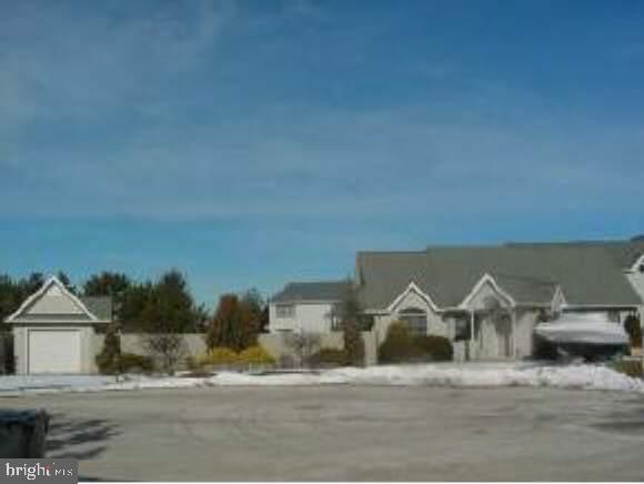 209 Peter Road Manahawkin, NJ 08050 - Photo 1 of 10 a front view of a house with a yard and garage