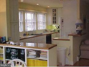 209 Peter Road Manahawkin, NJ 08050 - Photo 8 of 10 a kitchen with stainless steel appliances a sink stove and cabinets