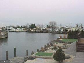 209 Peter Road Manahawkin, NJ 08050 - Photo 9 of 10 a view of a lake with a city