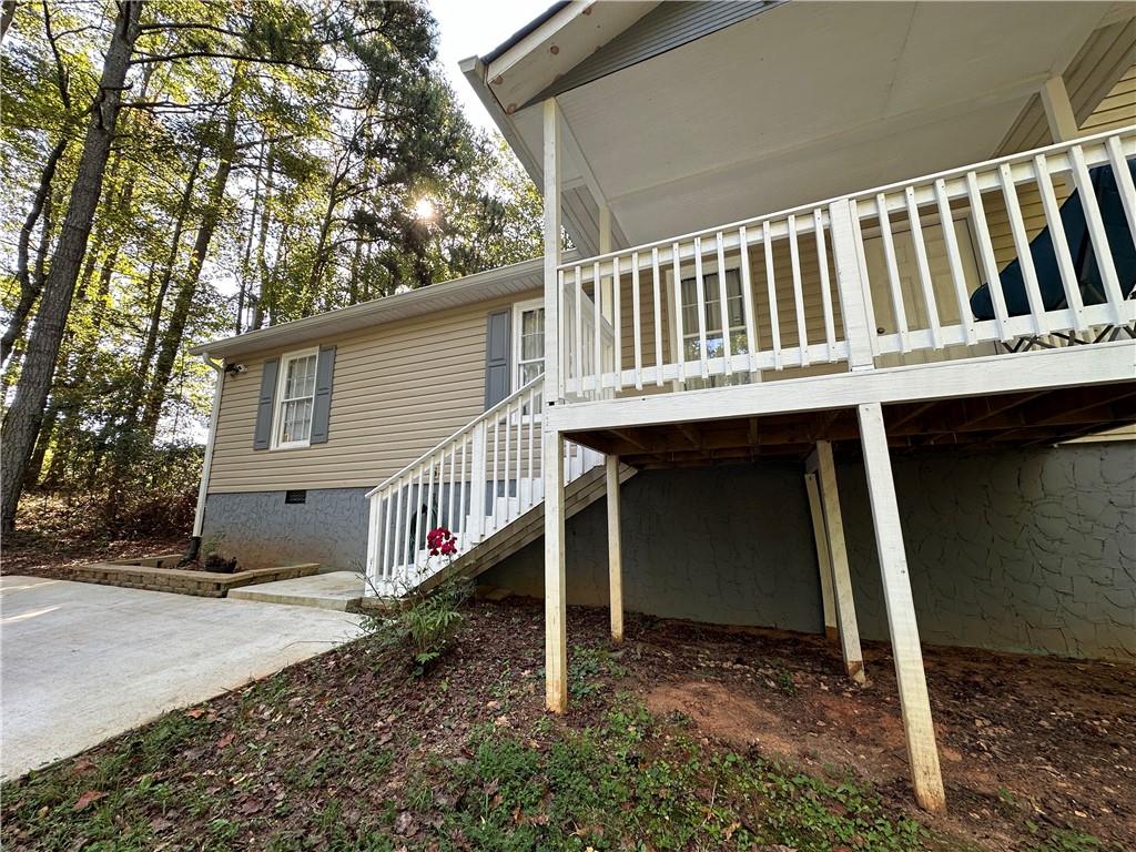 766 Country Club Road Newnan, GA 30263 - Photo 5 of 34 Back of property with crawl space, a deck, and stairway