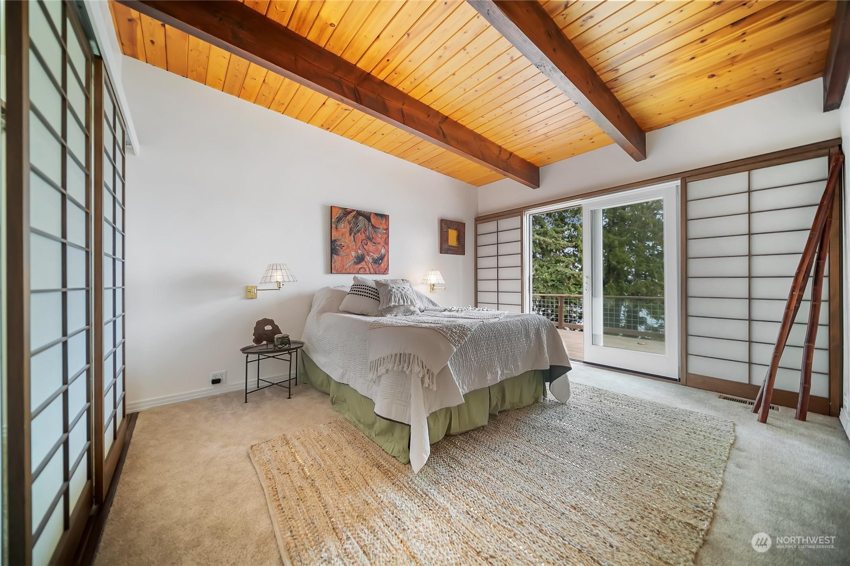 3217 West Sequim Bay Road Sequim, WA 98382 - Photo 14 of 40 a spacious bedroom with a bed and large windows