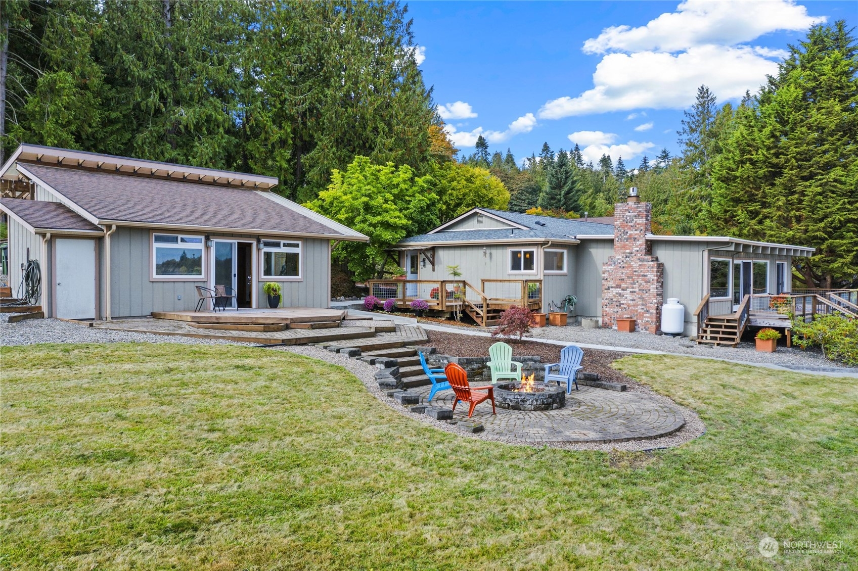 3217 West Sequim Bay Road Sequim, WA 98382 - Photo 17 of 40 a view of a house with swimming pool and sitting area