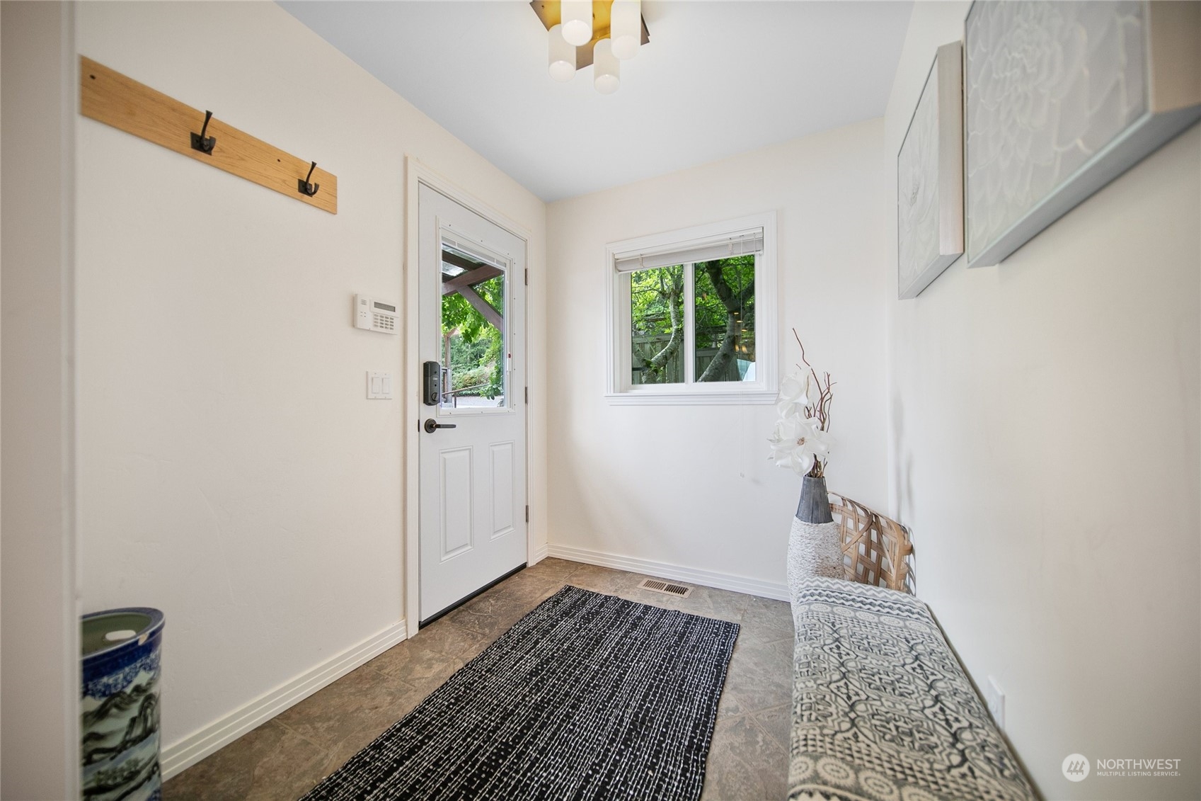 3217 West Sequim Bay Road Sequim, WA 98382 - Photo 22 of 40 a view of an empty room with wooden floor and a window