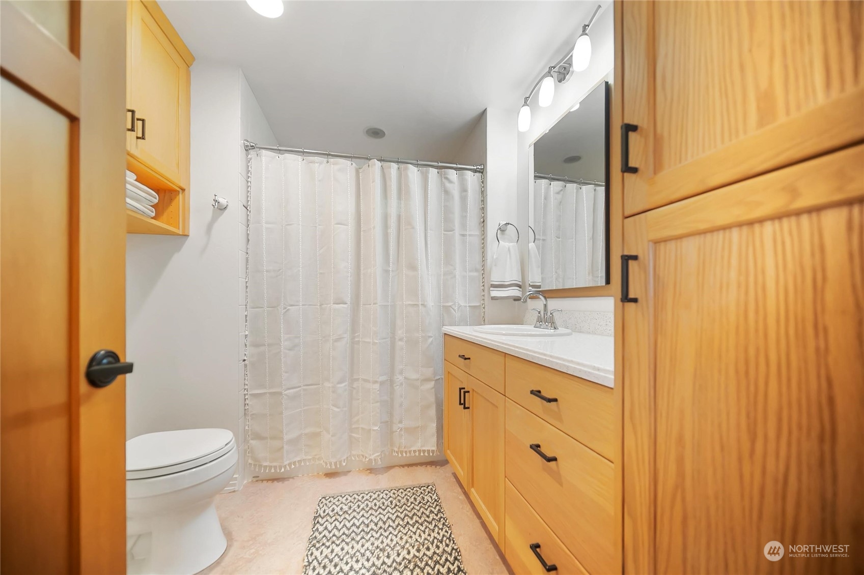 3217 West Sequim Bay Road Sequim, WA 98382 - Photo 23 of 40 a bathroom with a granite countertop sink toilet and shower