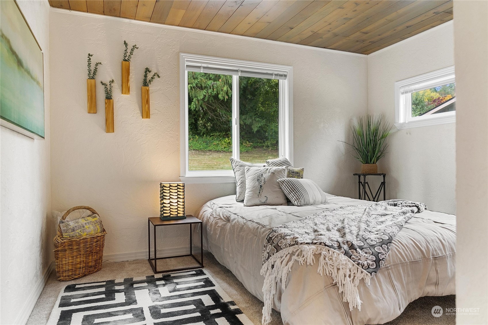 3217 West Sequim Bay Road Sequim, WA 98382 - Photo 25 of 40 a bedroom with a bed and a window