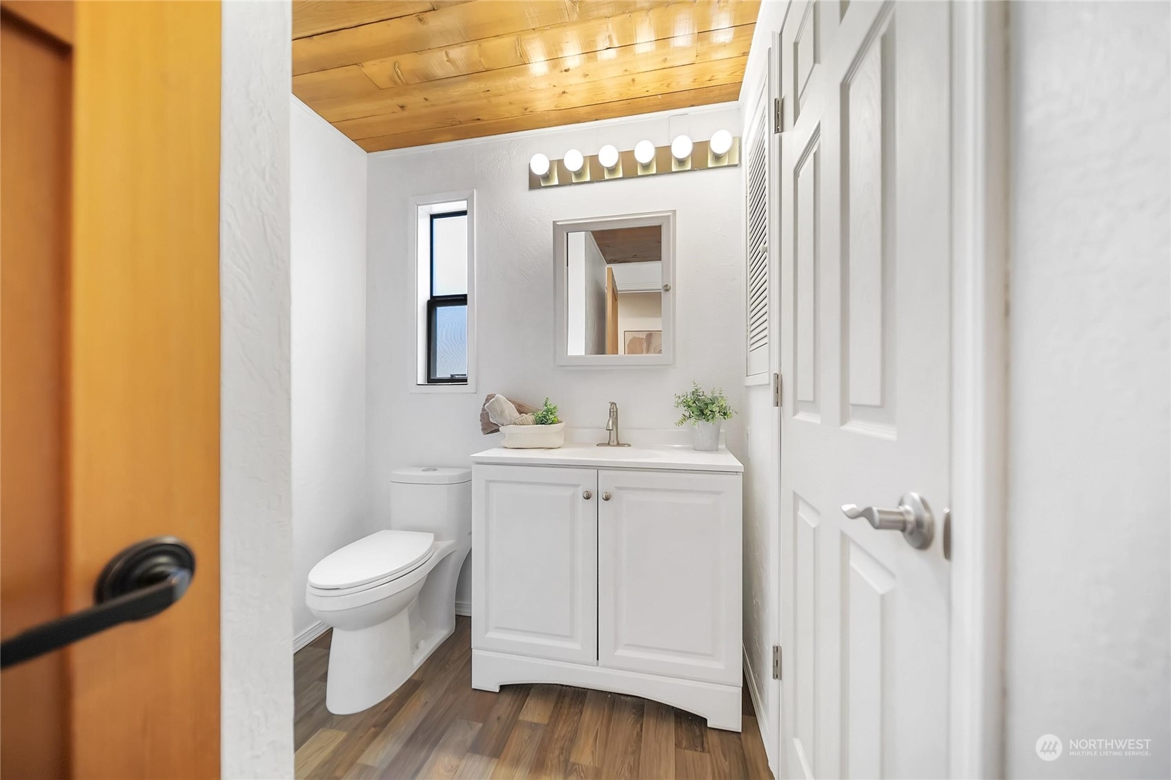 3217 West Sequim Bay Road Sequim, WA 98382 - Photo 27 of 40 a bathroom with a sink a toilet and a mirror
