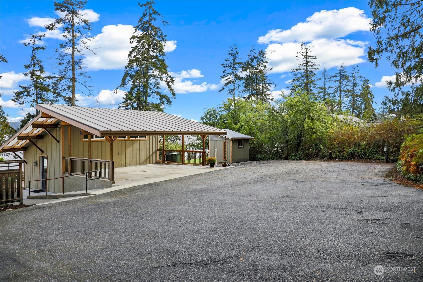 3217 West Sequim Bay Road Sequim, WA 98382 - Photo 34 of 40 a view of a house with a yard and sitting area