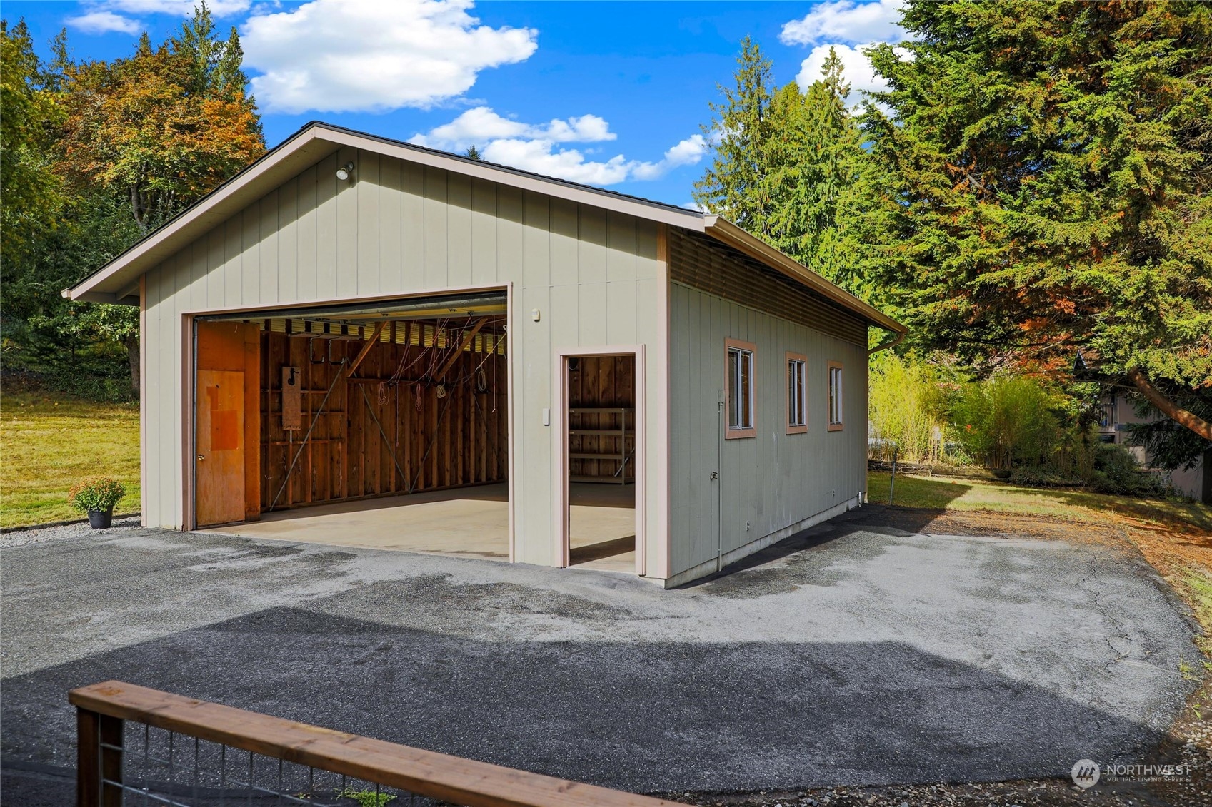 3217 West Sequim Bay Road Sequim, WA 98382 - Photo 35 of 40 a front view of a house with a yard and garage