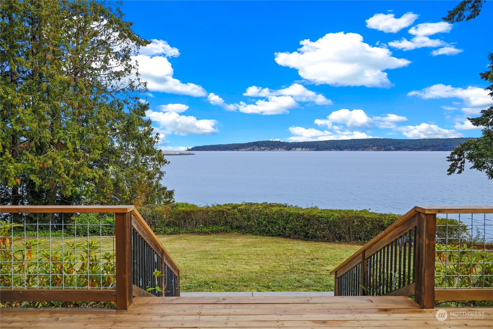 3217 West Sequim Bay Road Sequim, WA 98382 - Photo 5 of 40 a view of a balcony with floor to ceiling windows