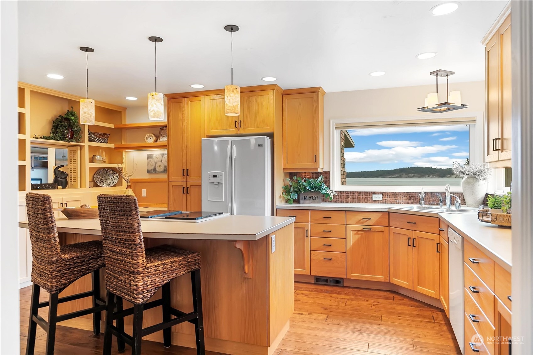 3217 West Sequim Bay Road Sequim, WA 98382 - Photo 7 of 40 a kitchen with stainless steel appliances granite countertop a sink a stove and a refrigerator