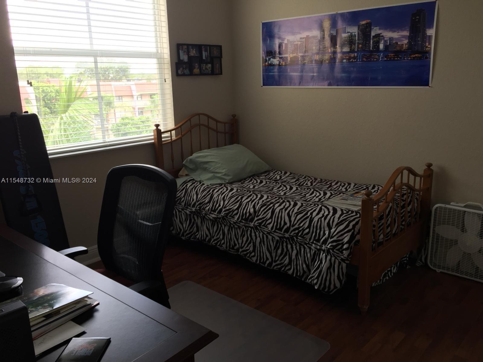 Kendall Miami, FL 33176 - Photo 12 of 15 a bedroom with furniture and a window