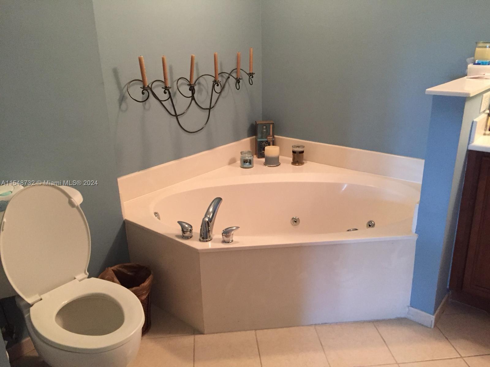 Kendall Miami, FL 33176 - Photo 8 of 15 a white bath tub sitting next to a white toilet