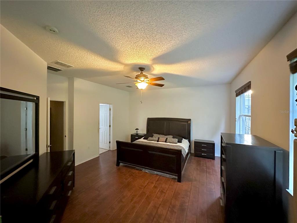 1225 Stone Harbour Road Winter Springs, FL 32708 - Photo 11 of 23 a living room with furniture and a flat screen tv