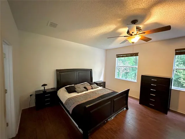 a bed room with a bed and a chandelier