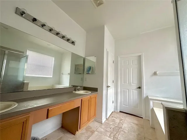 a kitchen with stainless steel appliances granite countertop a sink and a stove