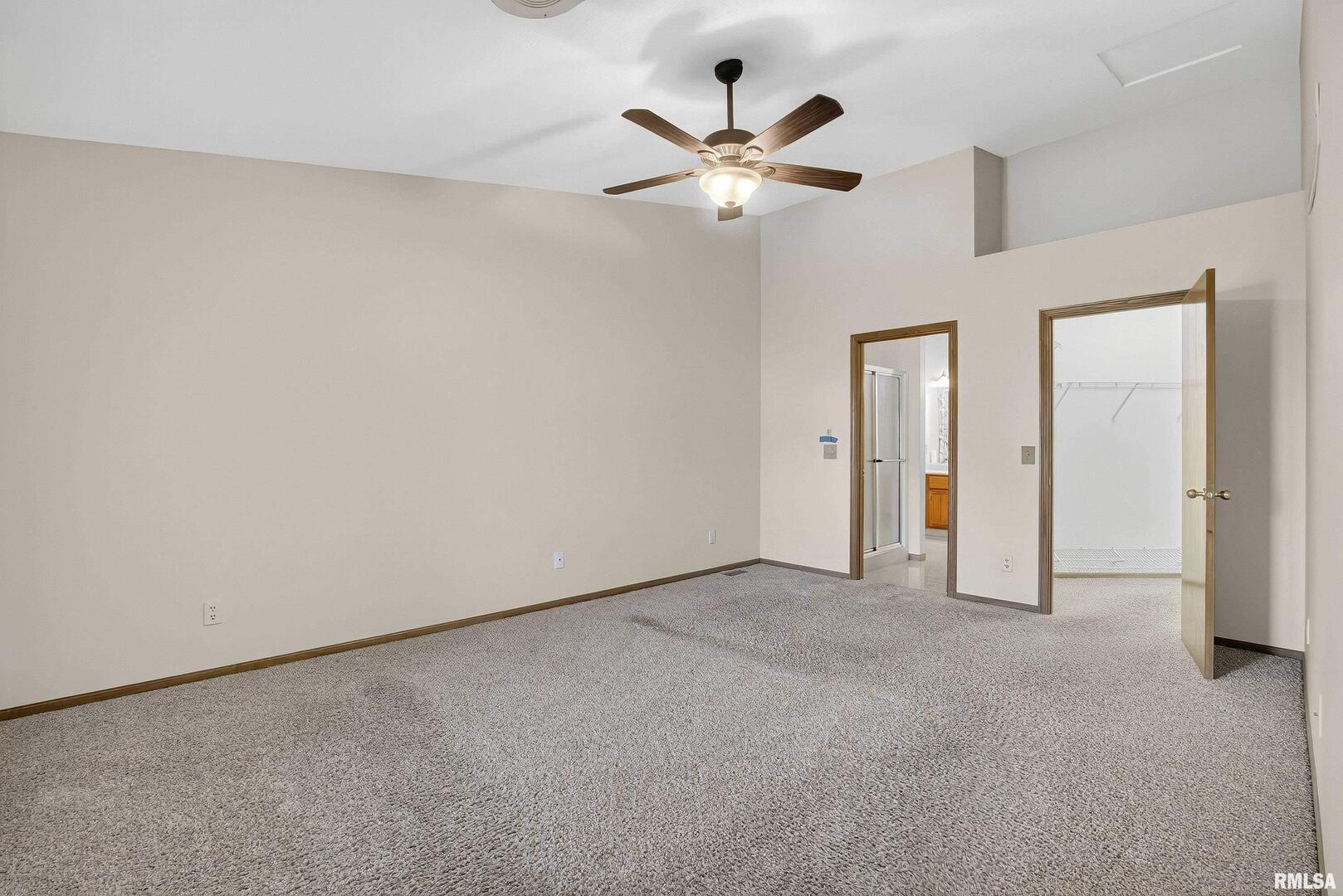 3988 Partridge Circle Bettendorf, IA 52722 - Photo 18 of 42 an empty room with closet and a chandelier fan
